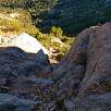 Vista atrás del primer resalte y la ermita de Sant Joan de Codolar al fondo / Grau dels Tres Esglaons 
